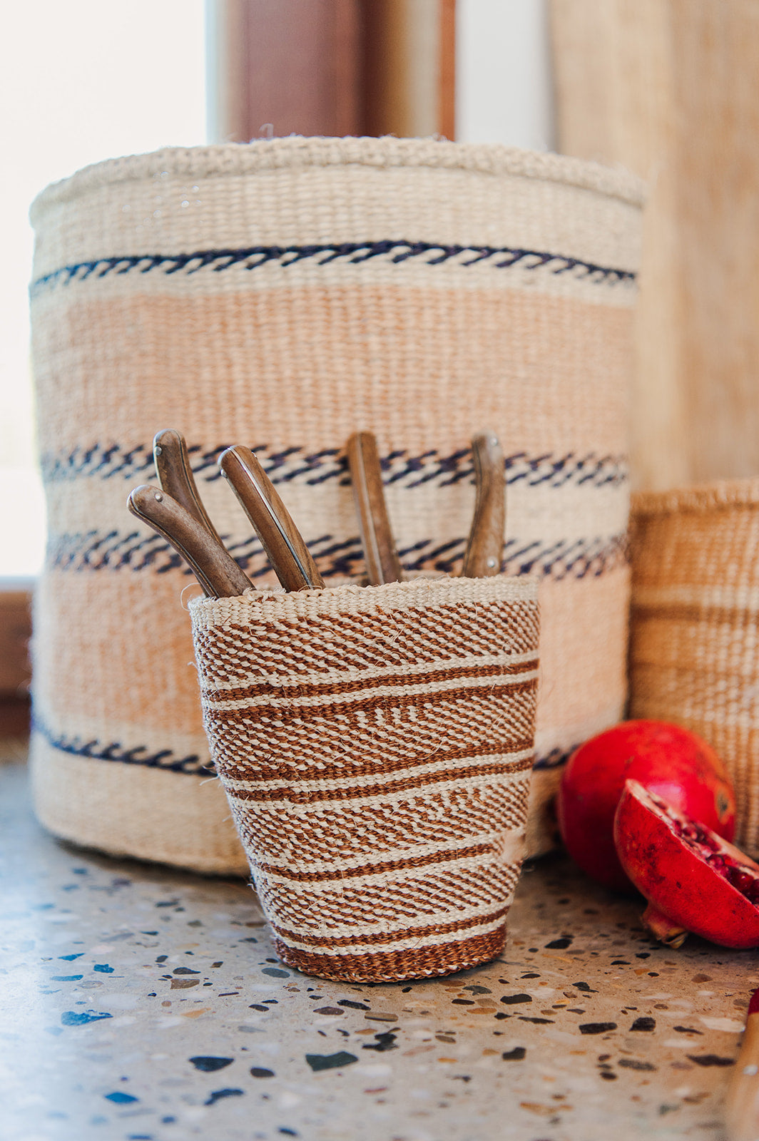 The basket in the back is a practical weave basket, not a fine weave